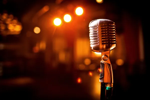 depositphotos_8790321-stock-photo-retro-microphone-on-stage