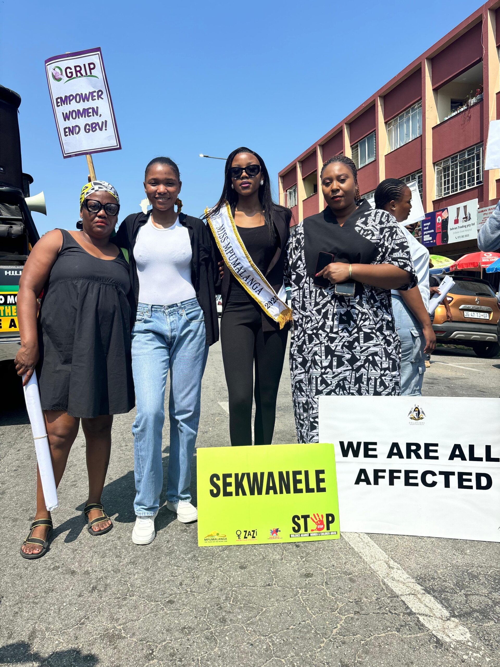 women stand against GBV